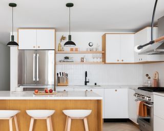 Small white kitchen ideas with white oak accents and an island with modern white stools