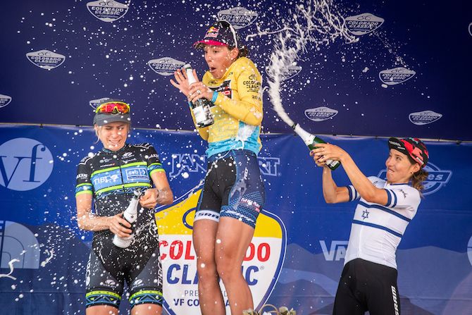 Chloe Dygert-Owen (Sho-Air Twenty2020) gets a soaking from second-placed Brodie Chapman (Tibco-SVB) and Omer Shapira (Canyon-SRAM) on the final podium of the 2019 Colorado Classic