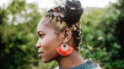 Side profile of woman wearing earrings