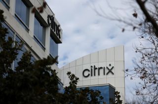 Citrix logo pictured on the side of an office complex in Santa Clara, California, with grey clouds in the background.