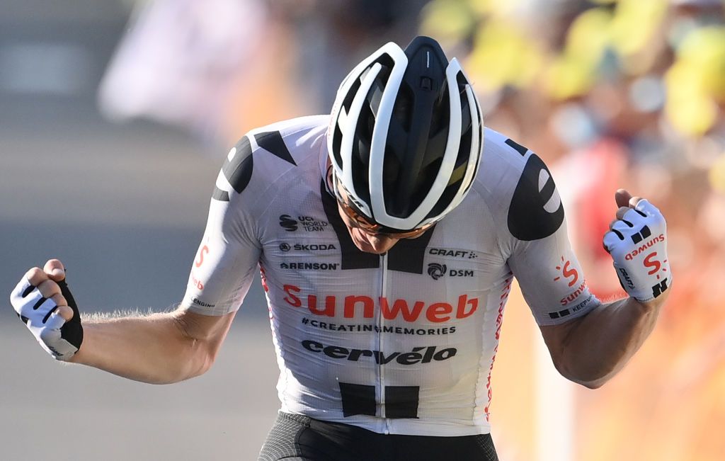 Stage winner Team Sunweb rider Denmarks Soren Kragh Andersen celebrates as he crosses the finish line at the end of the 19th stage of the 107th edition of the Tour de France cycling race 160 km between BourgenBresse and Champagnole on September 18 2020 Photo by Marco BERTORELLO POOL AFP Photo by MARCO BERTORELLOPOOLAFP via Getty Images