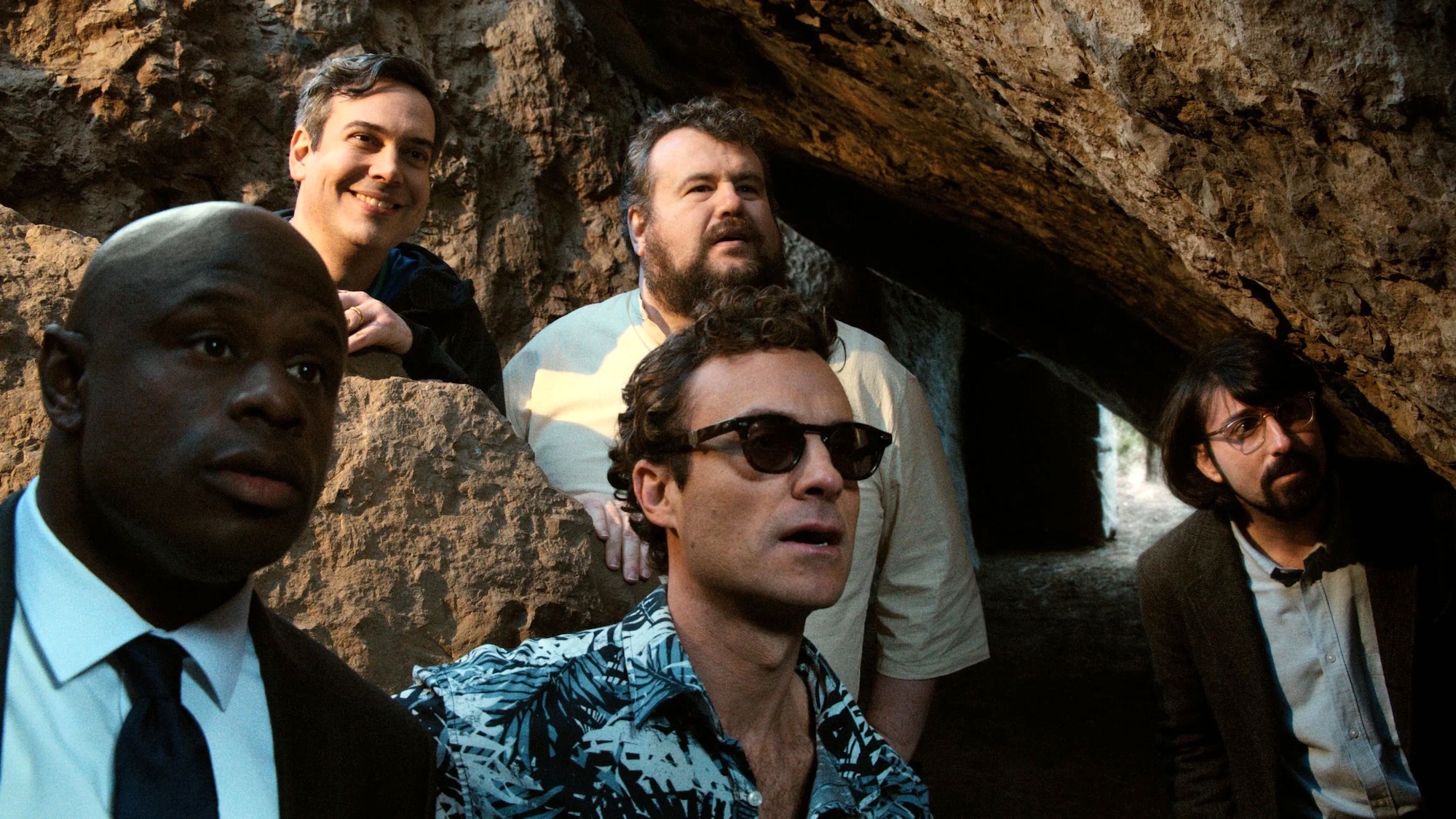 Miles Jr., Jack Jr. Mitch, Kevin, and Stifler's Brother standing at cave entrance in The Napa Boys
