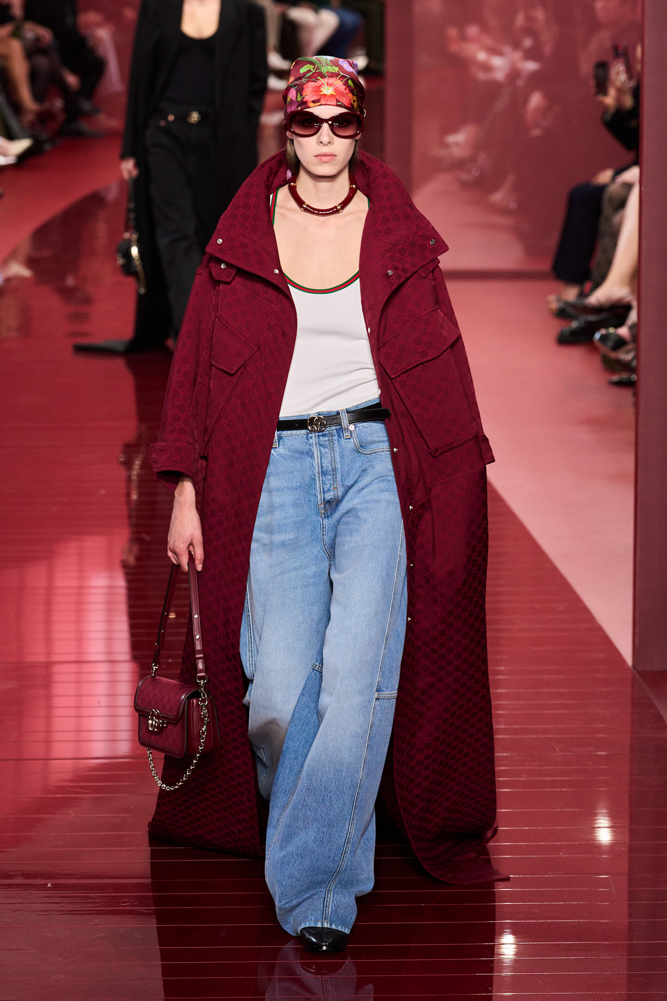 Model wears palazzo jeans on the Gucci runway.