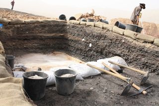 This image shows a trench at Slaves’ Hill at the end of the 2013 excavation. The black material is slag, waste of copper smelting in furnaces.