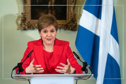 Nicola Sturgeon delivering a speech from behind a lecturn