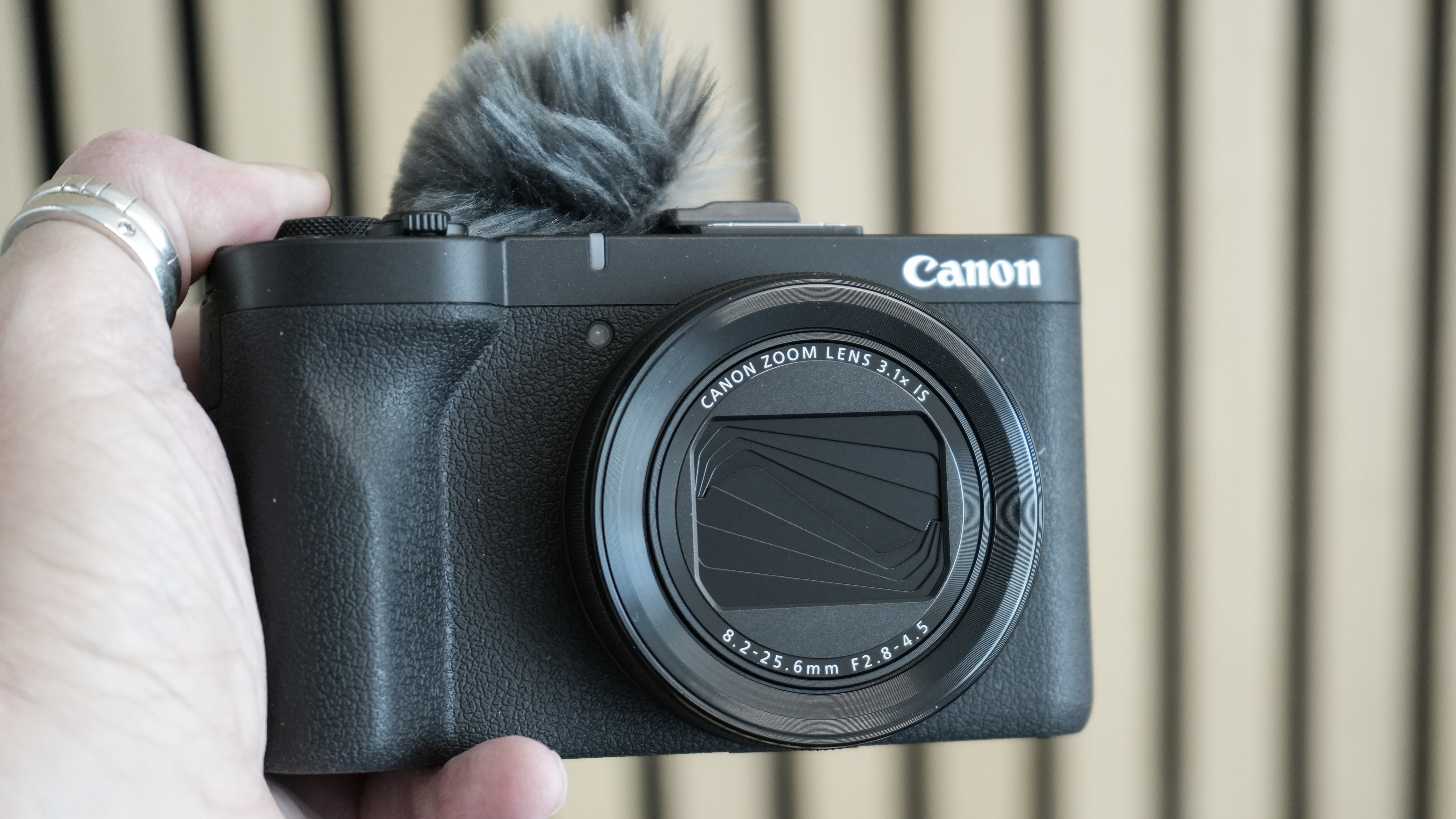 Canon PowerShot V1 being held in man's hand