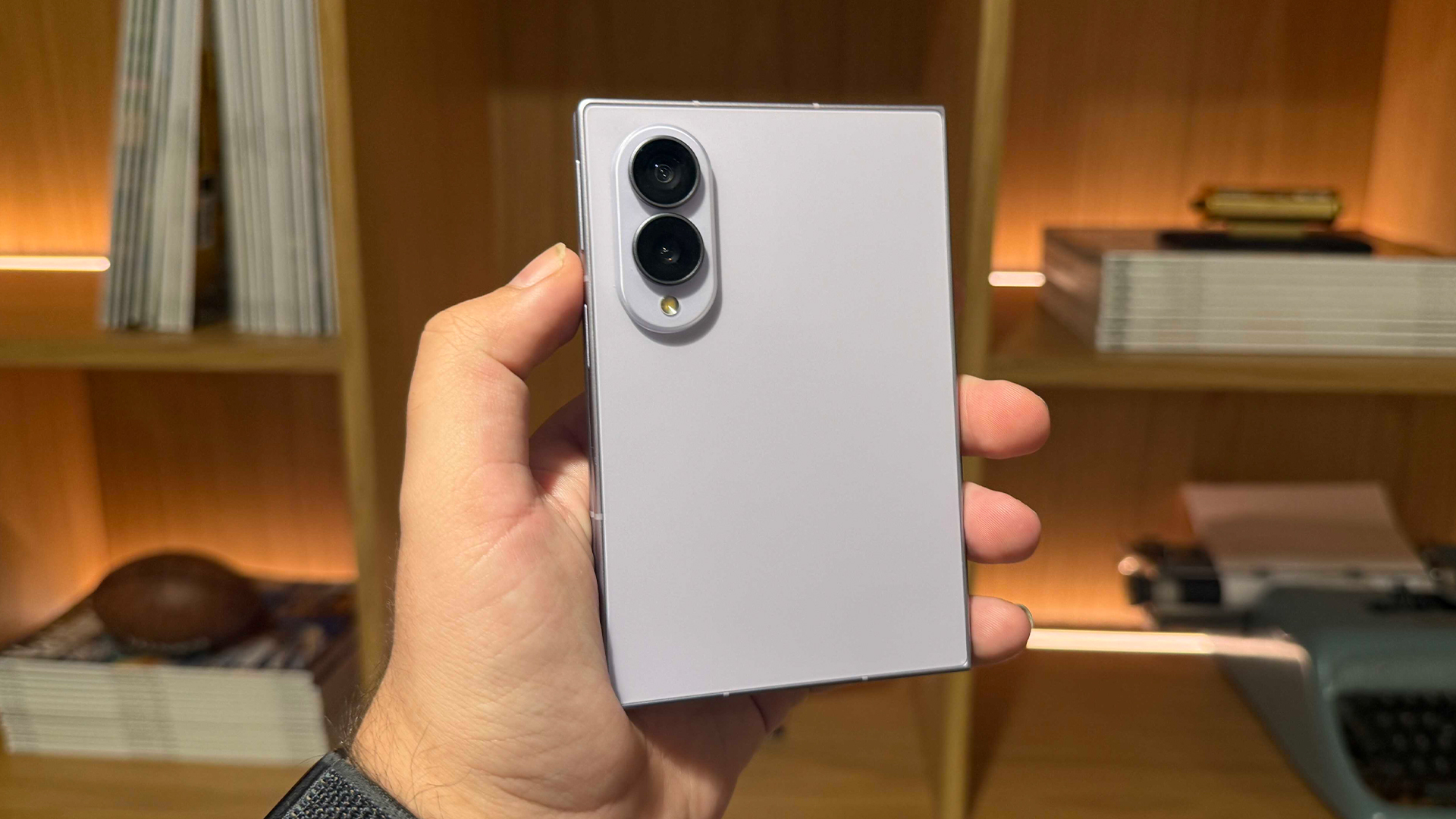 Samsung Galaxy Z Fold 8 smartphone held in hand showing back with rear camera array