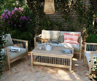 brick paved patio area with wooden furniture