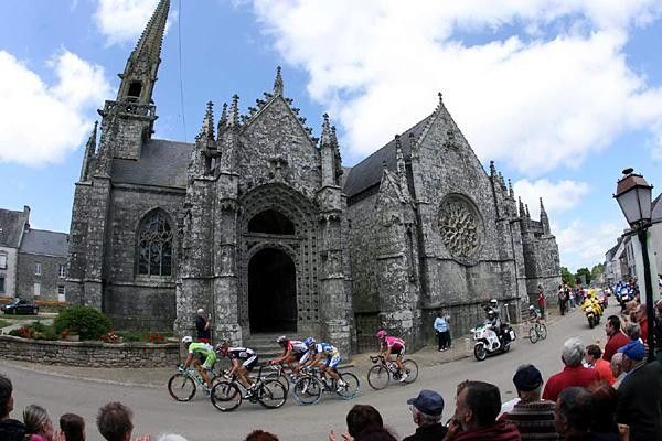 The break rides past an ancient cathedral in Brittany