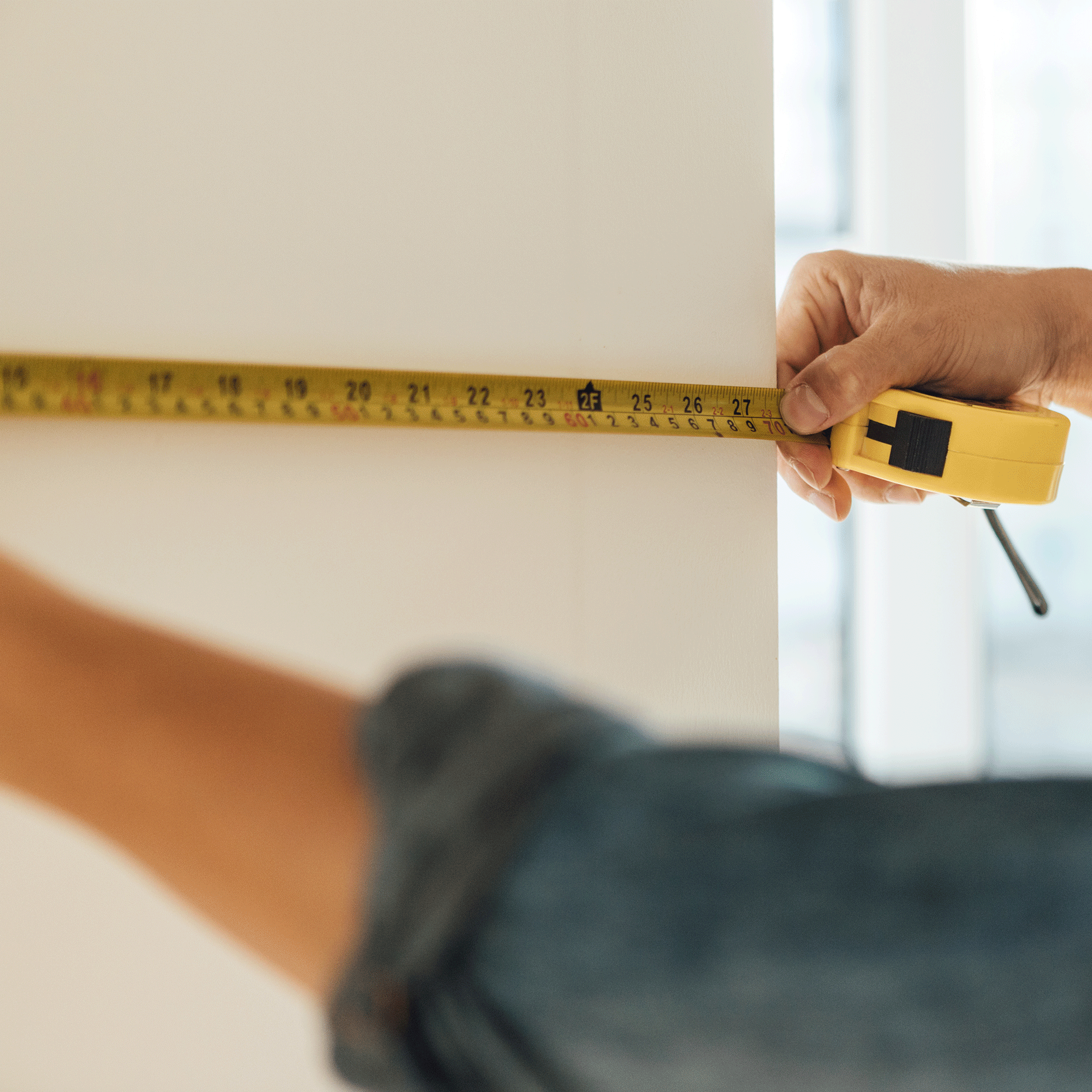 Tape measure against a wall