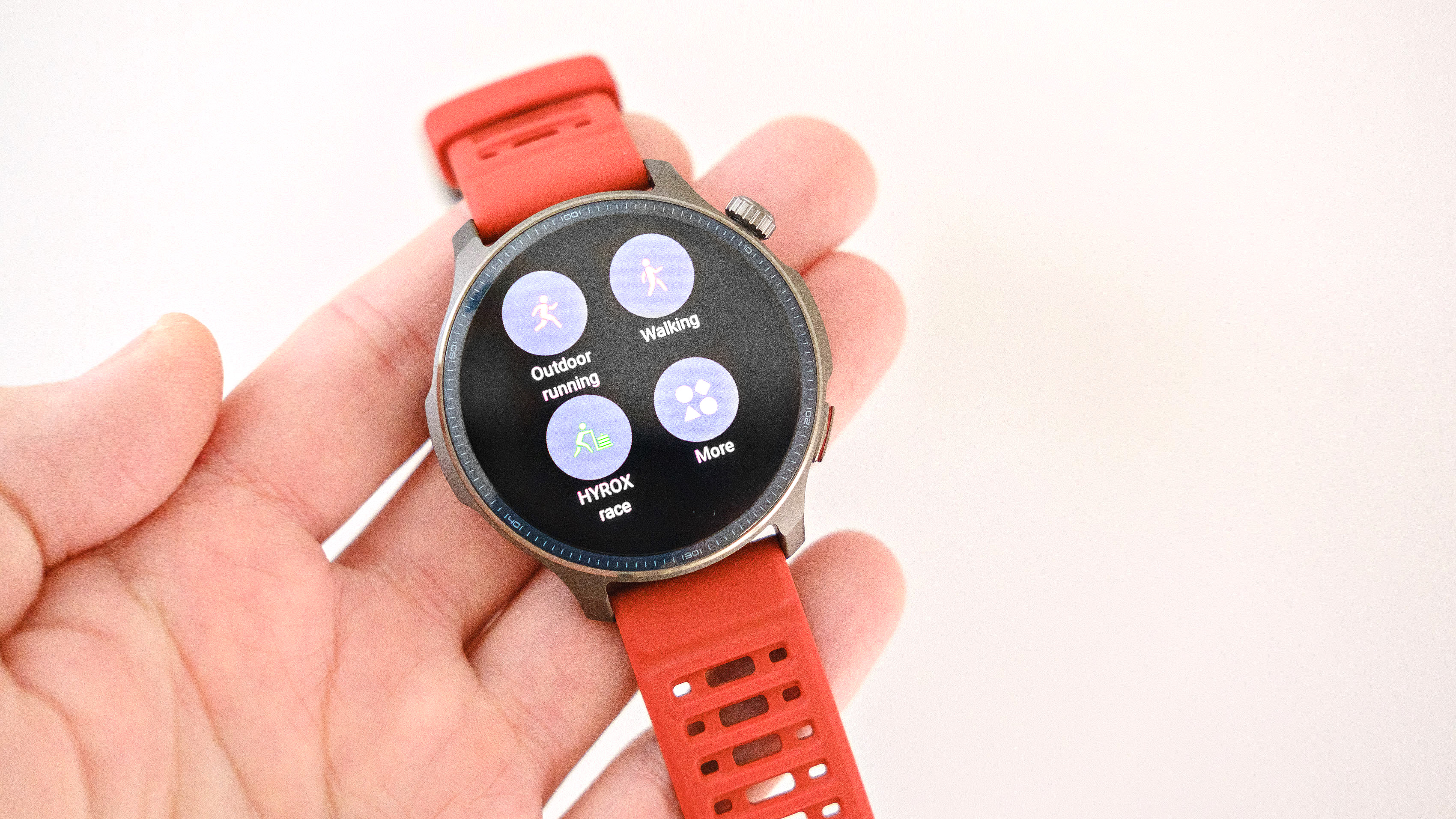 Close-up of the Amazfit Balance 2 smartwatch on an orange rubber strap