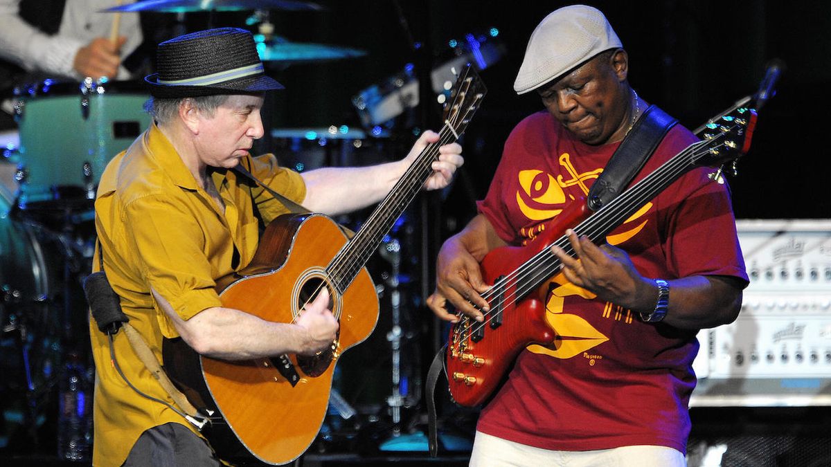 Paul Simon (L) performs with bass guitarist Bakithi Kumalo on the Auditorum Stravinski stage during the 42nd Montreux Jazz Festival on July 9, 2008 in Montreux.