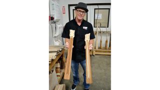 Greg Burnett shows off two in-production necks with channels cut for both truss rod and reinforcing inserts for rock-solid stability