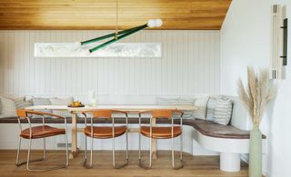 curved banquette seating in a modern dining room