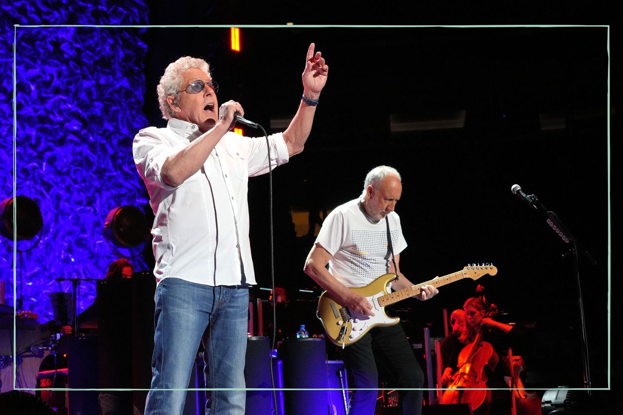 Roger Daltrey and Pete Townshend from The Who performing on stage