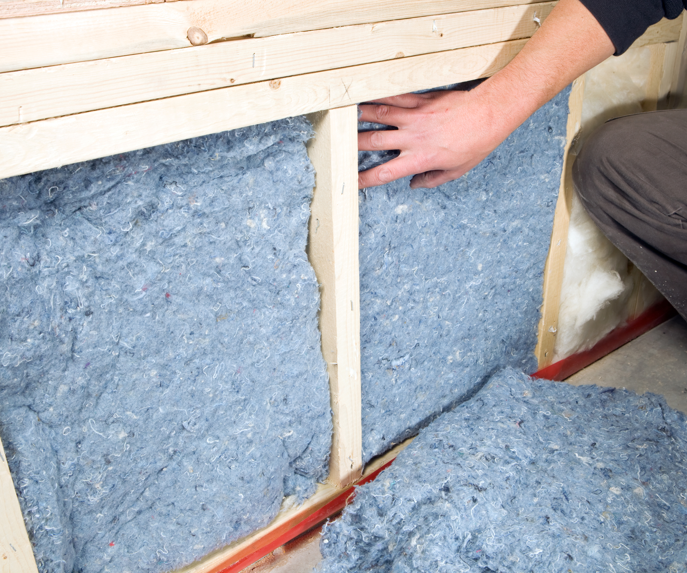 denim insulation batts being used in wall insulation
