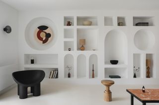 A living room with different shaped cubbies