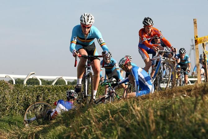 Tim Merlier (Belgium) and David van der Poel (Netherlands) thread their way through a crash