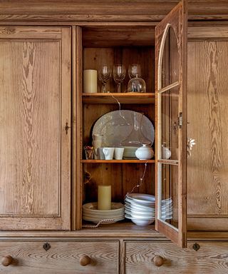 wooden kitchen cupboard with cutlery