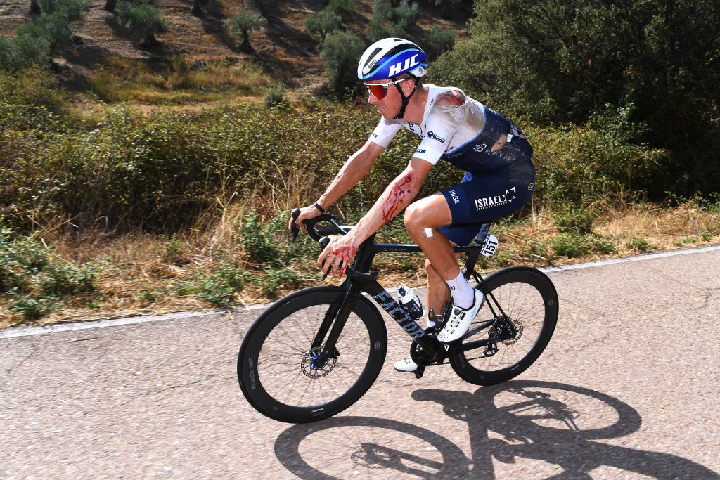 PICO VILLUERCAS SPAIN AUGUST 28 Sep Vanmarcke of Belgium and Team Israel StartUp Nation is injured after his fall during the 76th Tour of Spain 2021 Stage 14 a 1657km stage from Don Benito to Pico Villuercas 1580m lavuelta LaVuelta21 on August 28 2021 in Pico Villuercas Spain Photo by Tim de WaeleGetty Images