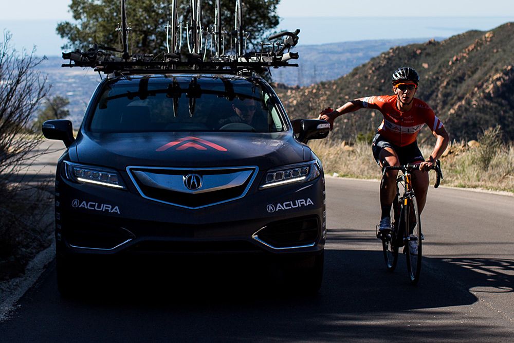 Hannah Ross gets a feed from Pat McCarty inside the team car.