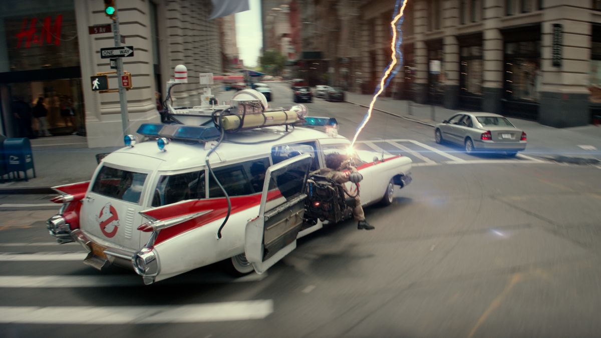 The Ecto-1 races through New York City as someone fires a proton pack from the gunner seat in &quot;Ghostbusters: Frozen Empire&quot;