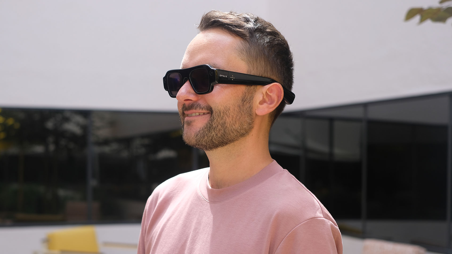 A photo of a person wearing Snap Specs.