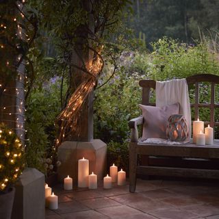 garden bench surrounded by outdoor lights
