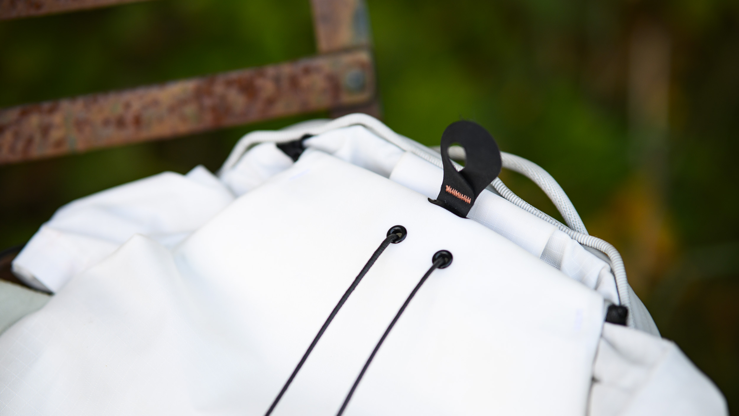 Close up of the Peak Design Outdoor Backpack 25L's pull cord