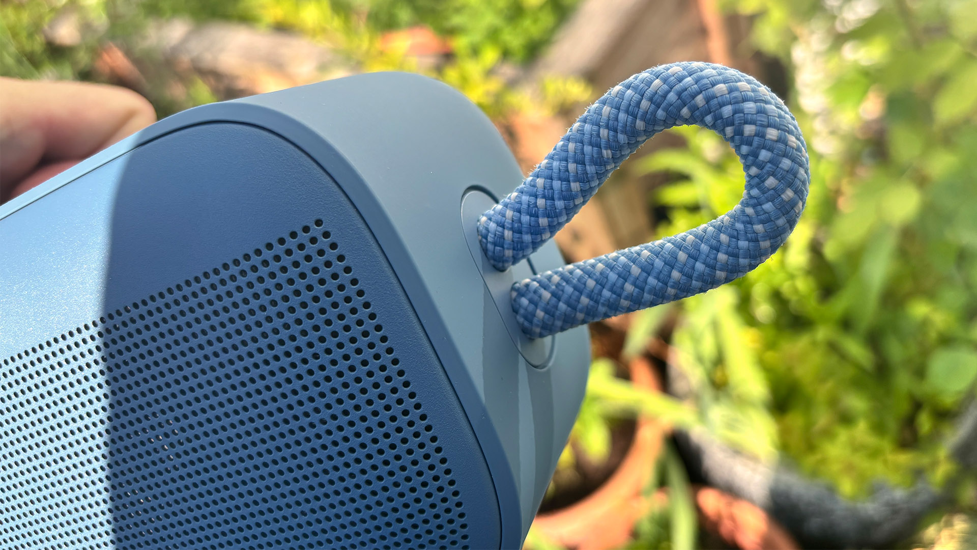 Bose SoundLink Plus wireless speaker end of speaker detail of grille and carry handle