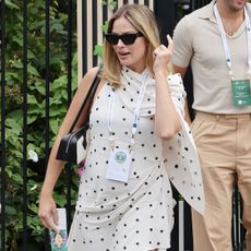 Margot Robbie wears an elegant polka-dot dress and two-tone bag at Wimbledon 2024