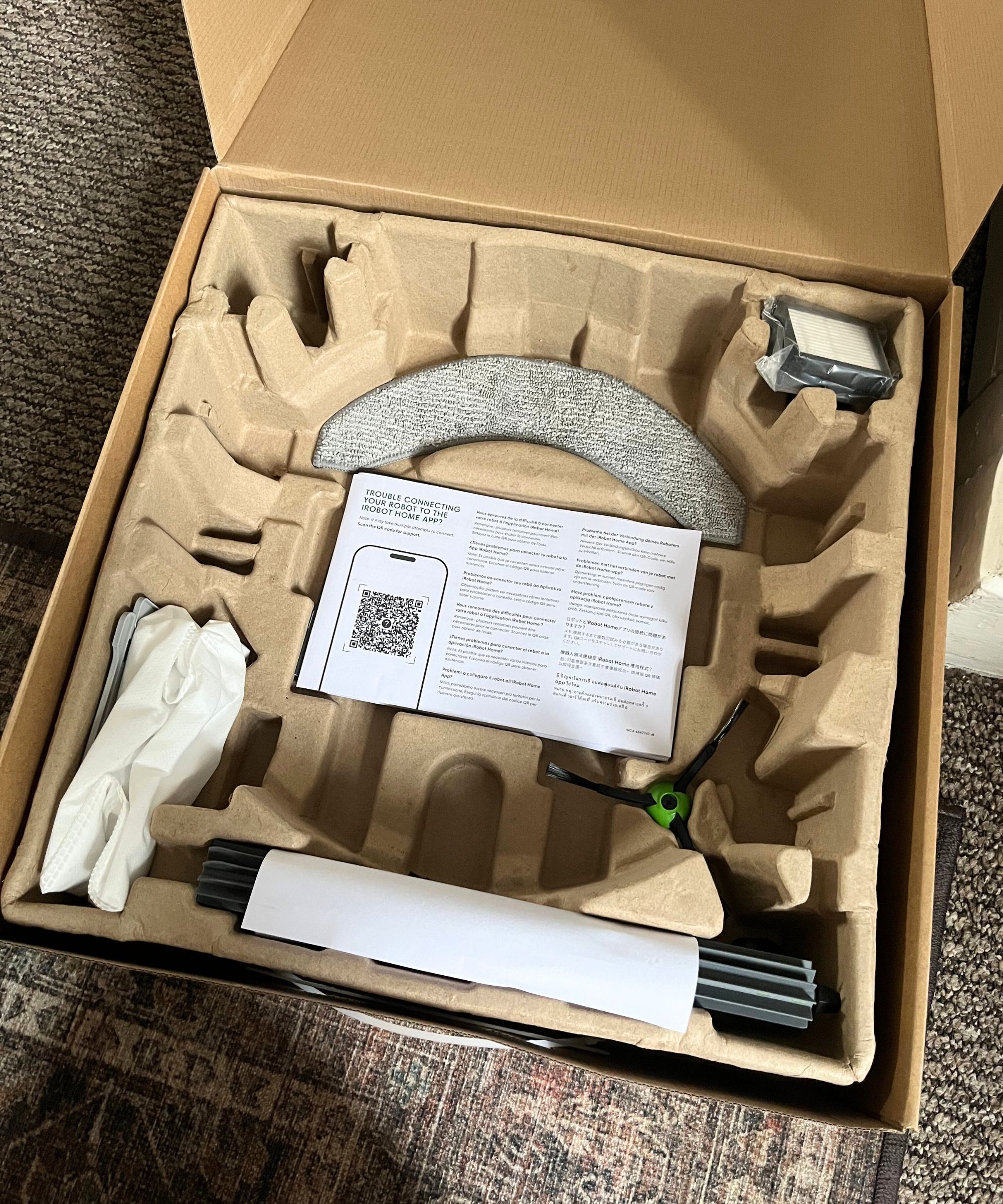 The cardboard packaging of the Roomba