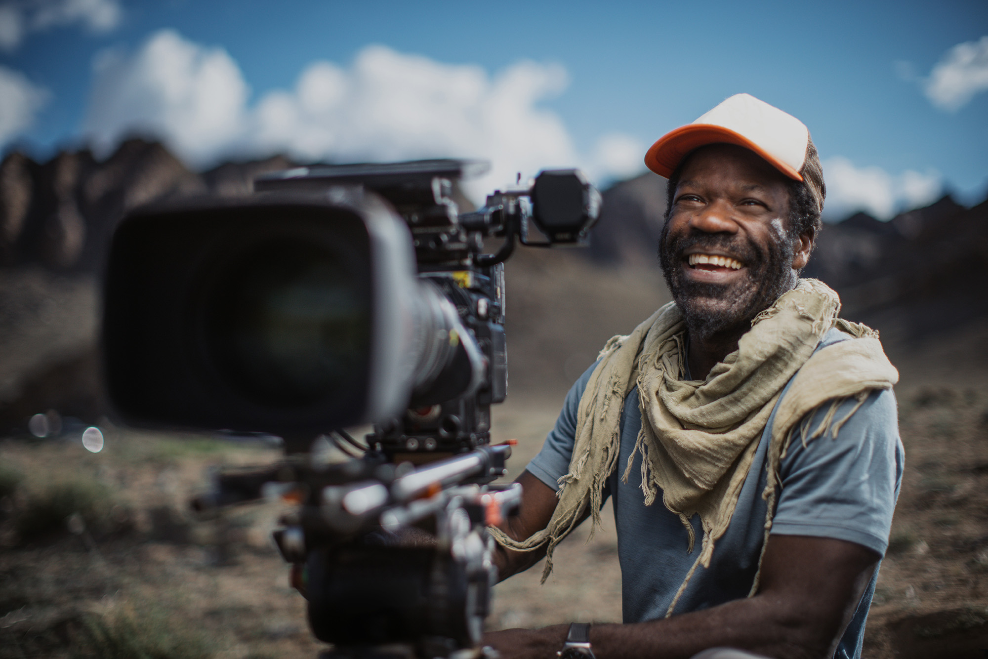 The Wild Ones presenter Vianet Djenguet smiling while operating a cinema camera 