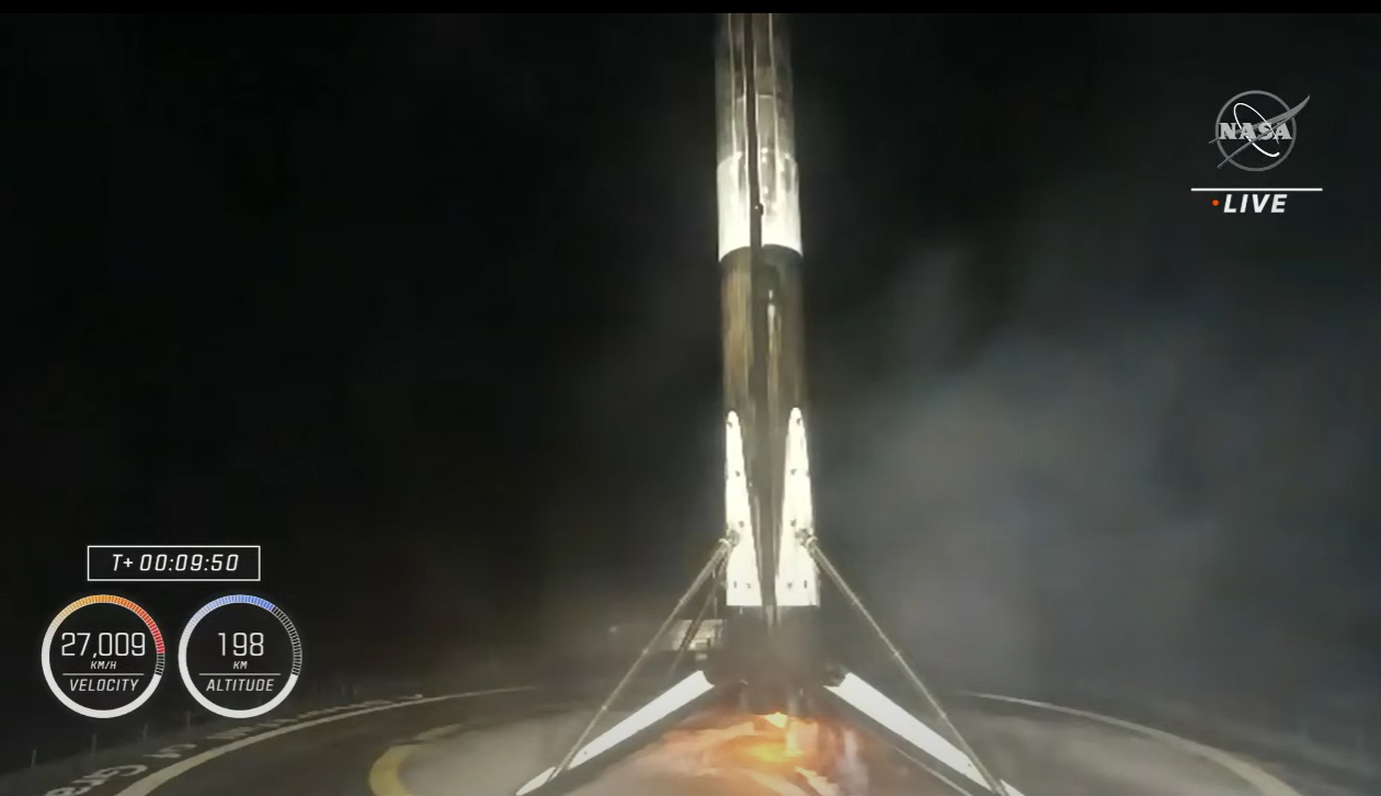 The SpaceX Falcon 9 rocket booster for the Crew-4 astronaut mission stands atop a drone ship after a successful landing on April 27, 2022.