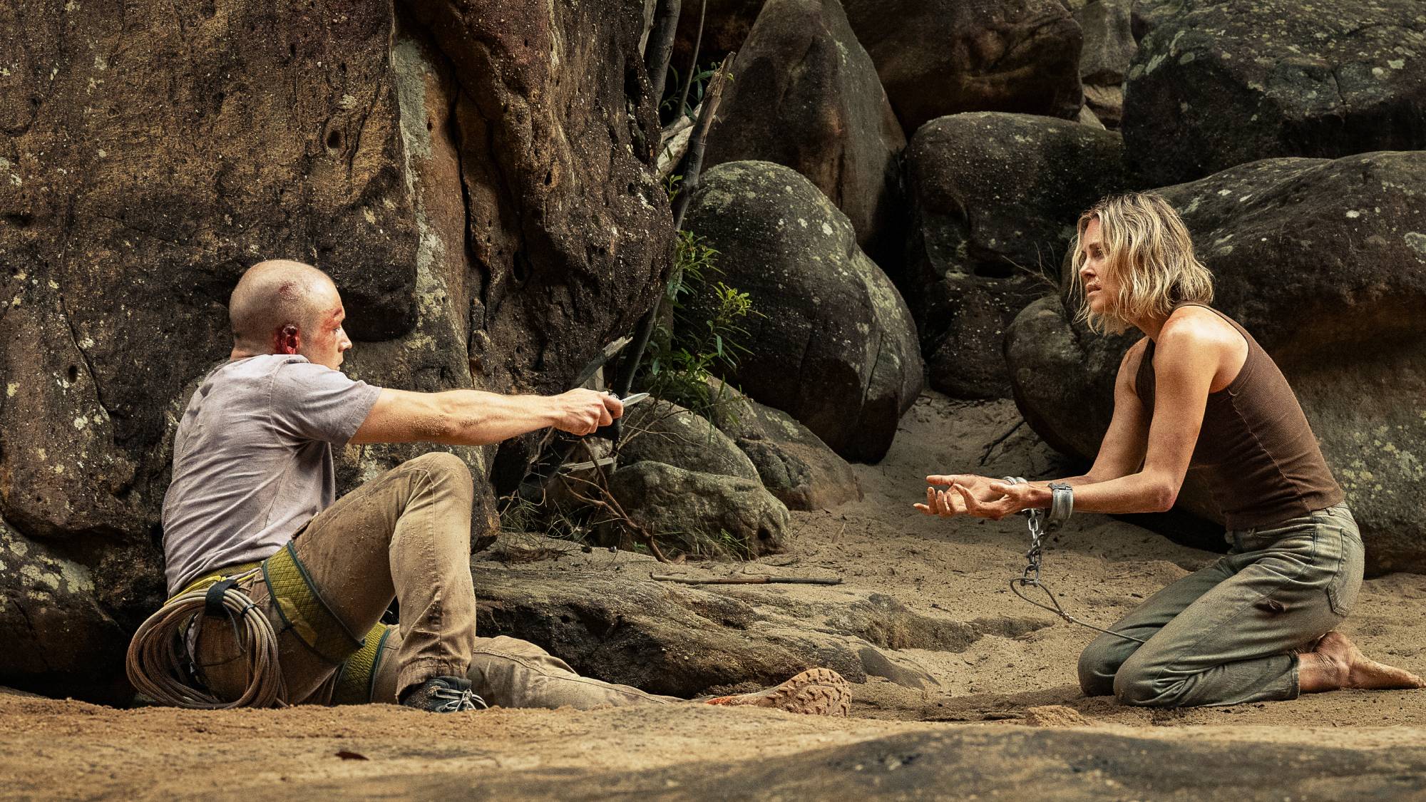 Taron Egerton as Ben and Charlize Theron as Sasha in "Apex" movie on Netflix (2026)