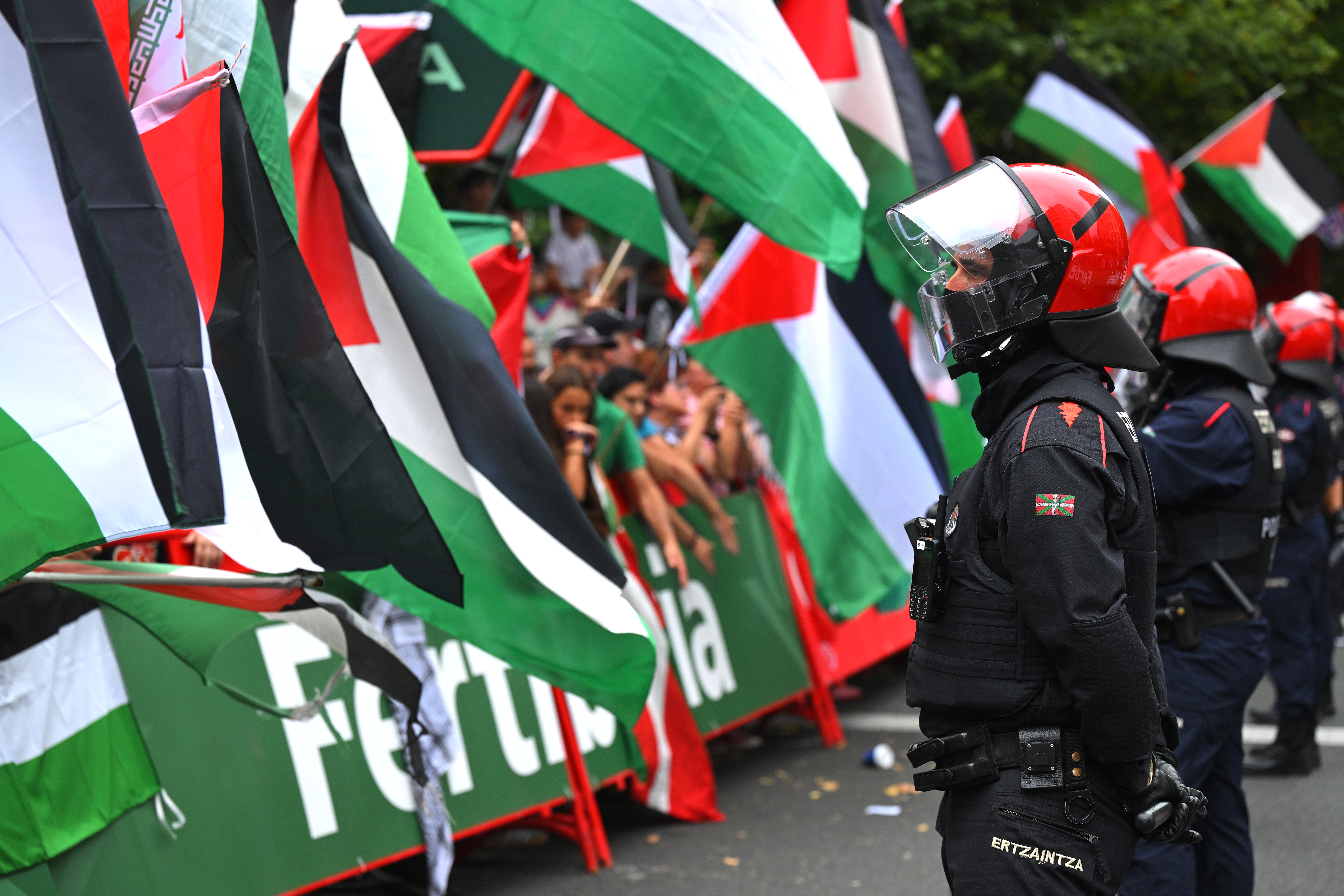 A policeman faces a pro-Palestine protest on stage 11 of the Vuelta a España