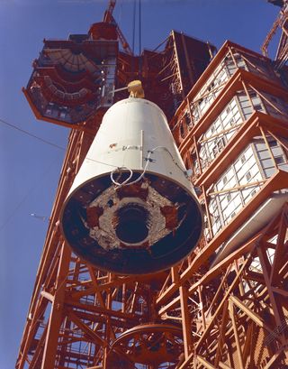 Engineers at NASA's Kennedy Space Center hoist the Saturn Lunar Module (LM) Adapter into position during assembly of the 204LM-1, an uncrewed Apollo mission (also called Apollo 5) that tested the Apollo Lunar Module in Earth orbit. This image was taken on