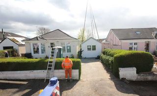 Stuart and Margaret Waldman decided to build an annexe in order to pass on their existing home to their daughter. The annexe was designed and built by The Wee House Company to replace an existing 3.6m-wide garage, so that the view from the street would remain the same; it had to be craned into position (shown). Permission was obtained for ancillary accommodation, so the annexe cannot be let or sold independently of the main house