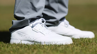 Our tester wearing the adidas adicross retro golf shoes on the golf course showing off their fantastic leather stitching