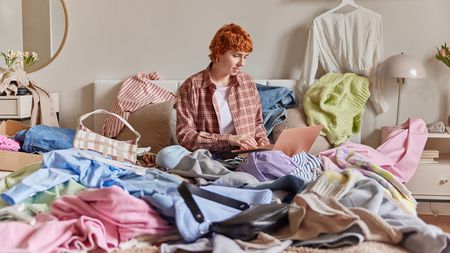 Decluttering clothes on the bed