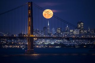 A photograph of moonrise over San Francisco.