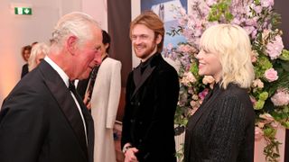 london, england september 28 prince charles, prince of wales, meets no time to die performers finneas and billie eilish at the no time to die world premiere at royal albert hall on september 28, 2021 in london, england photo by chris jackson wpa poolgetty images