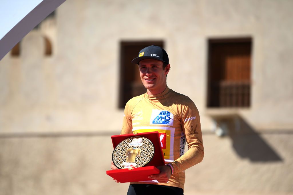 JABAL AL AKHDHAR OMAN FEBRUARY 15 Louis Bendixen of Denmark and UnoX Pro Cycling Team Gold Most Active Rider Jersey celebrates at podium during the 12th Tour of Oman 2023 Stage 5 a 1522km from Samail to Jabal Al Akhdhar 1214m TourofOman on February 15 2023 in Jabal Al Akhdhar Oman Photo by Alex BroadwayGetty Images