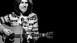 George Harrison performing on 'Saturday Night Live' with an acoustic guitar