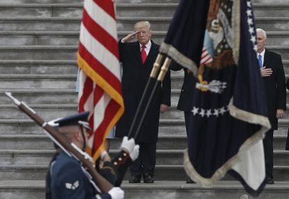 Trump salutes during a military parade