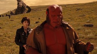 Ron Perlman stands shocked with Selma Blair behind him in Hellboy II: The Golden Army.