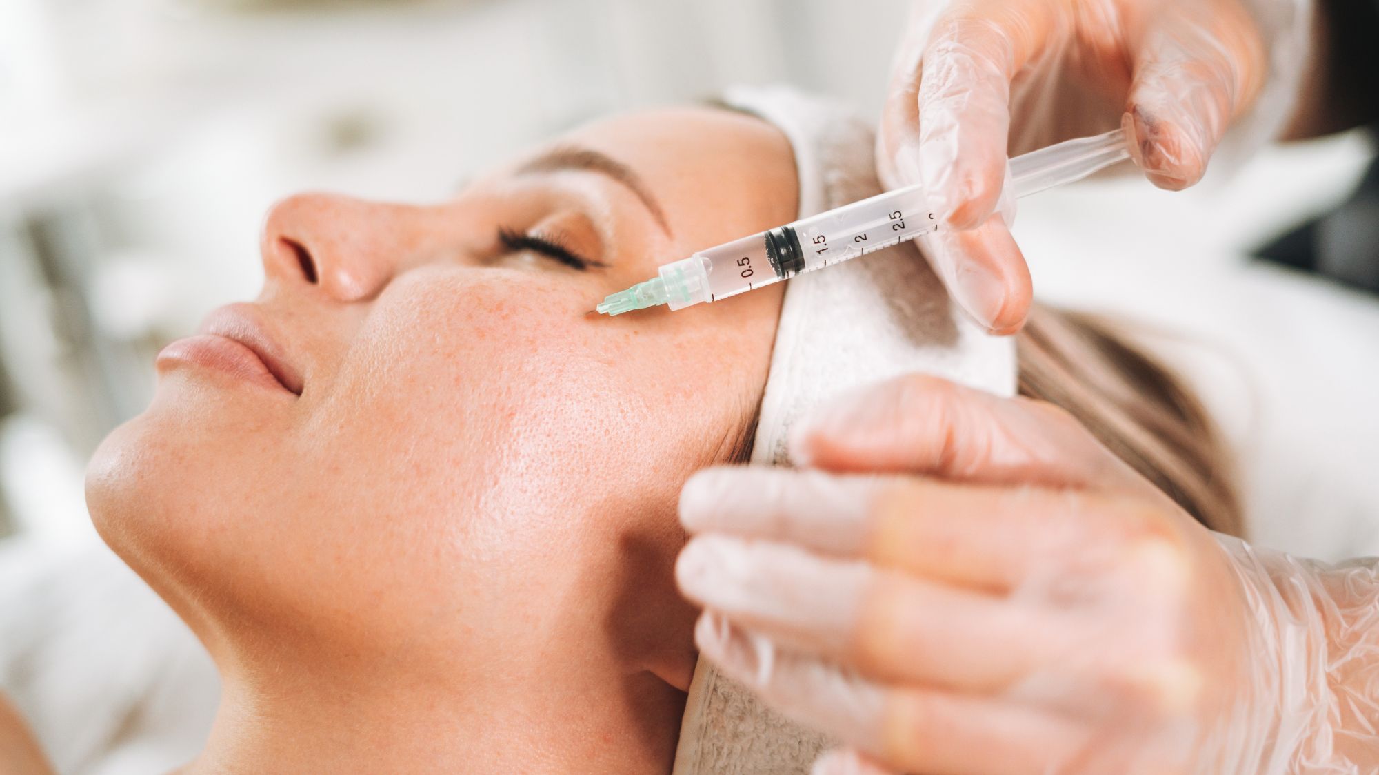 A closeup image of a woman getting botox