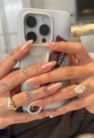 Frosted, nude chrome nails on Hailey Bieber by Zola Ganzorigt.