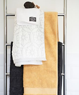 Different sized towels on towel rail