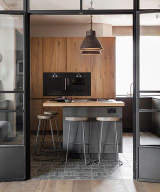 Oak cabinet kitchen with bespoke steel doors
